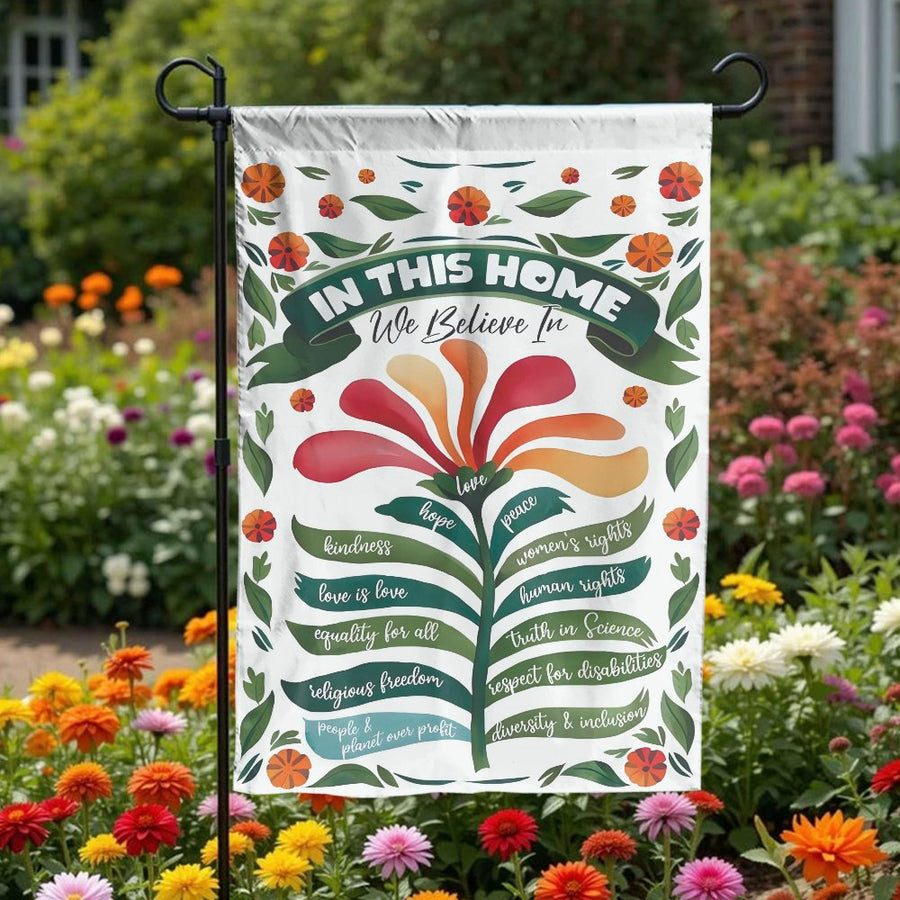 In This Home We Believe Garden Flag | Floral Progressive Values Sign | Double Sided Polyester | Welcoming Housewarming Gift