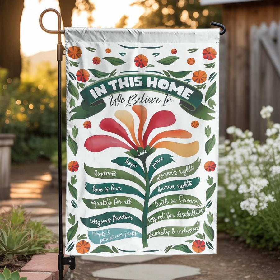 In This Home We Believe Garden Flag | Floral Progressive Values Sign | Double Sided Polyester | Welcoming Housewarming Gift