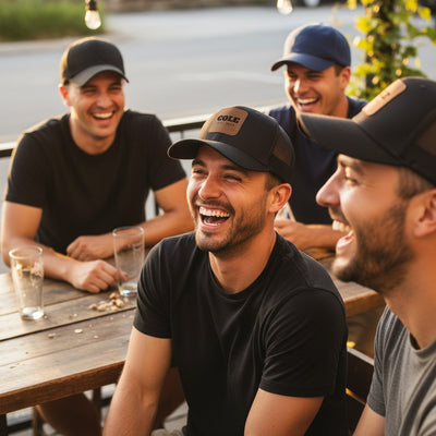 Groomsmen at a table wearing matching leather patch caps